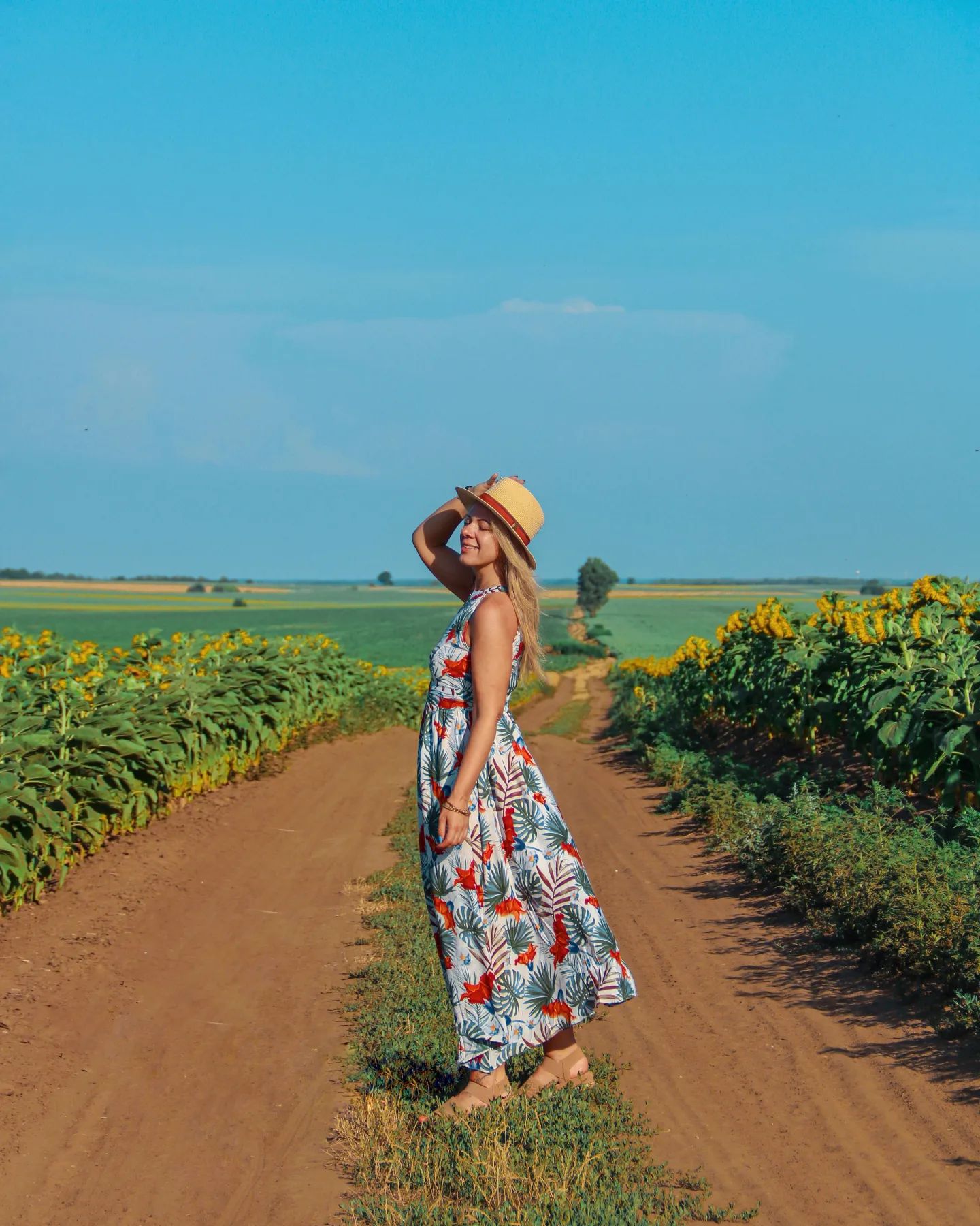 Ivory Tropical Leaf & Floral Printed Poly Chiffon Maxi Dress with Halter Neckline and Flowing