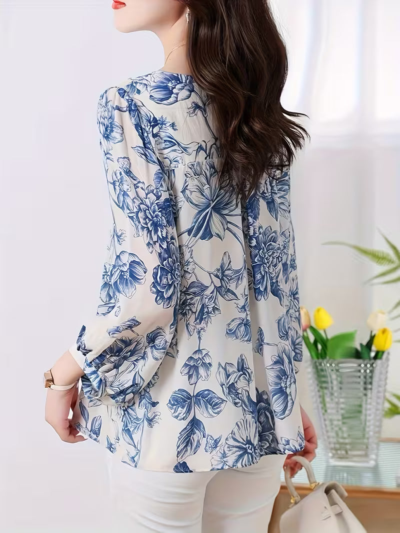 This graceful Top features a soothing palette of blue floral prints