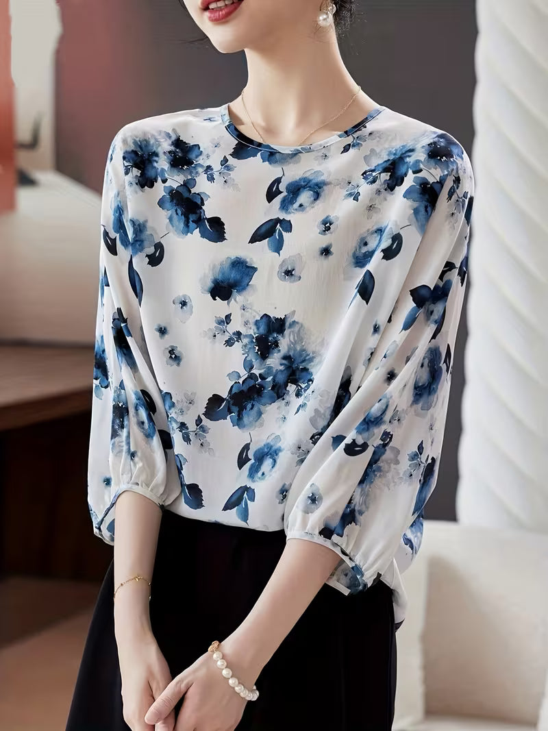 This refined Top showcases a delicate floral print Top