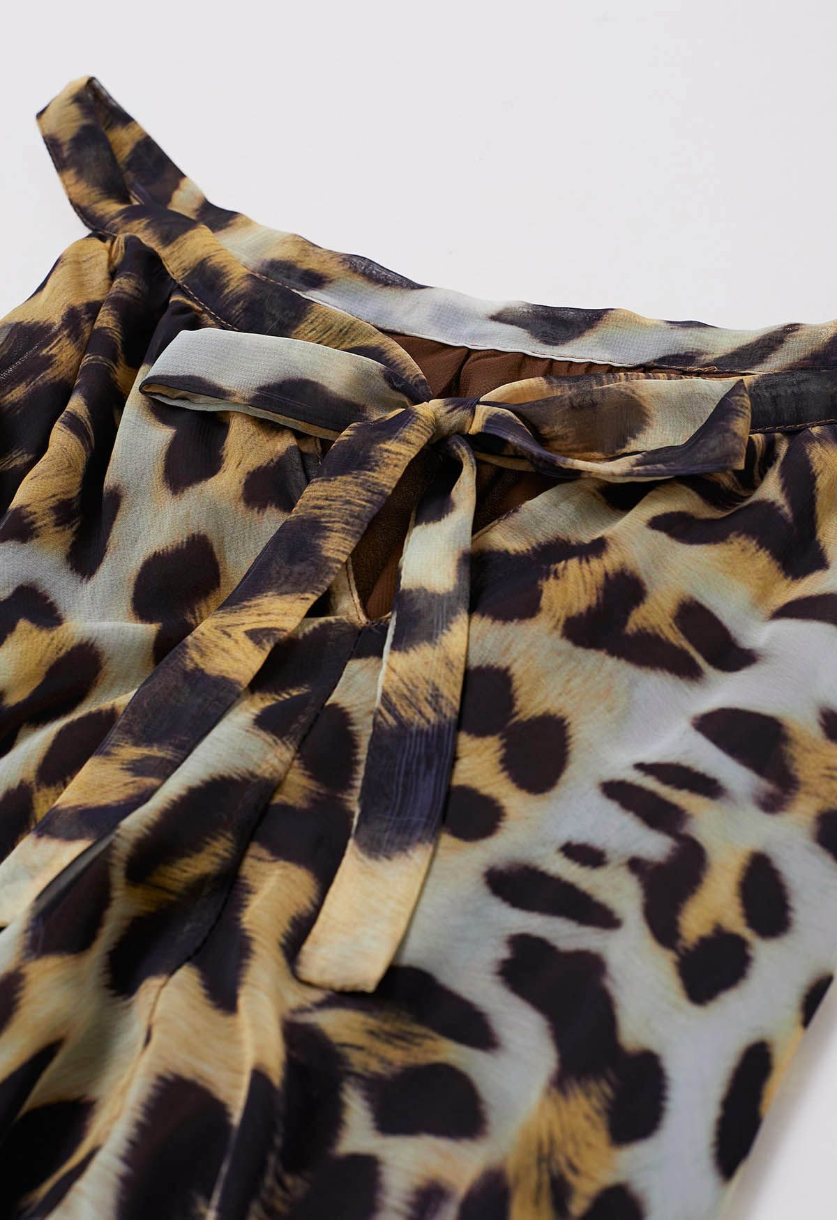 Ivory Tropical Leaf & Floral Printed Poly Chiffon Maxi Dress with Halter Neckline and Flowing