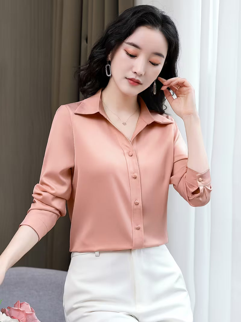 Elegant shirt is crafted from a lustrous silk satin