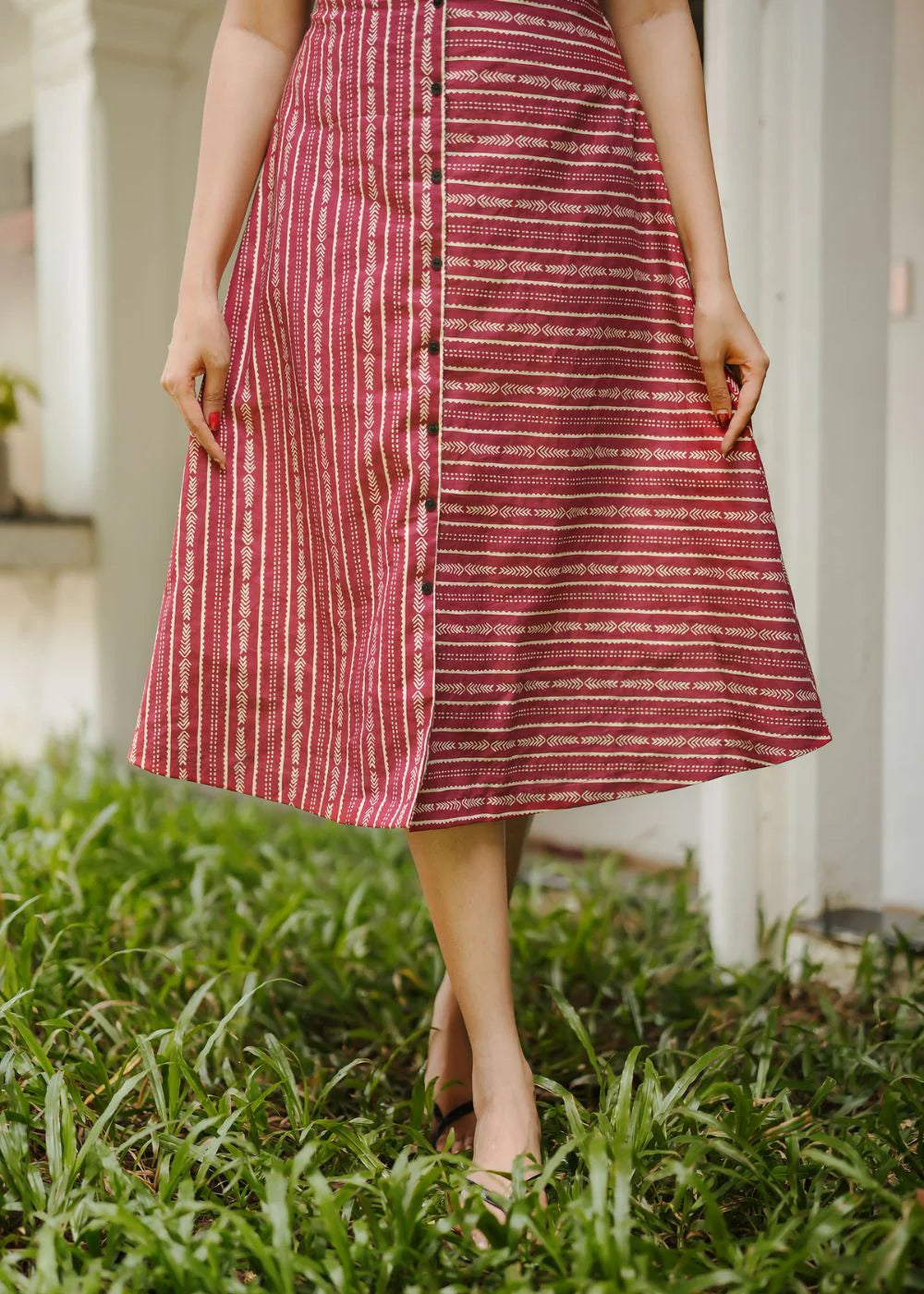 A classy cream &amp; multicolor striped dress featuring a V neck