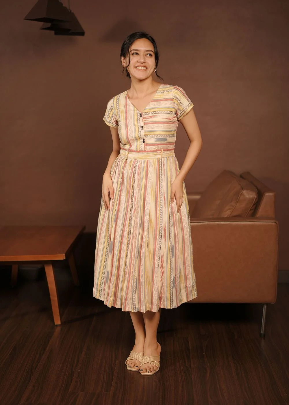 A classy cream &amp; multicolor striped dress featuring a V neck