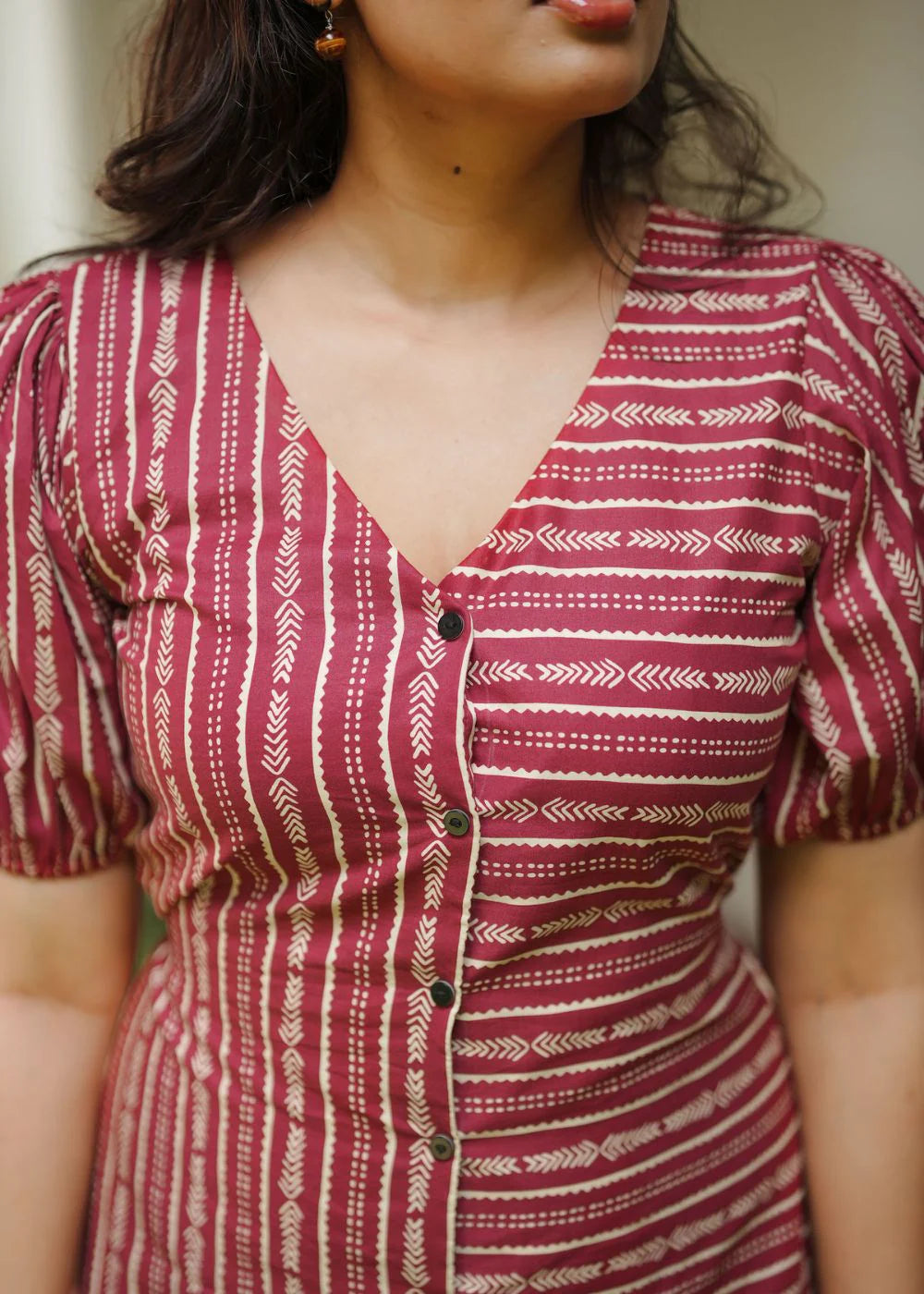 A classy cream &amp; multicolor striped dress featuring a V neck