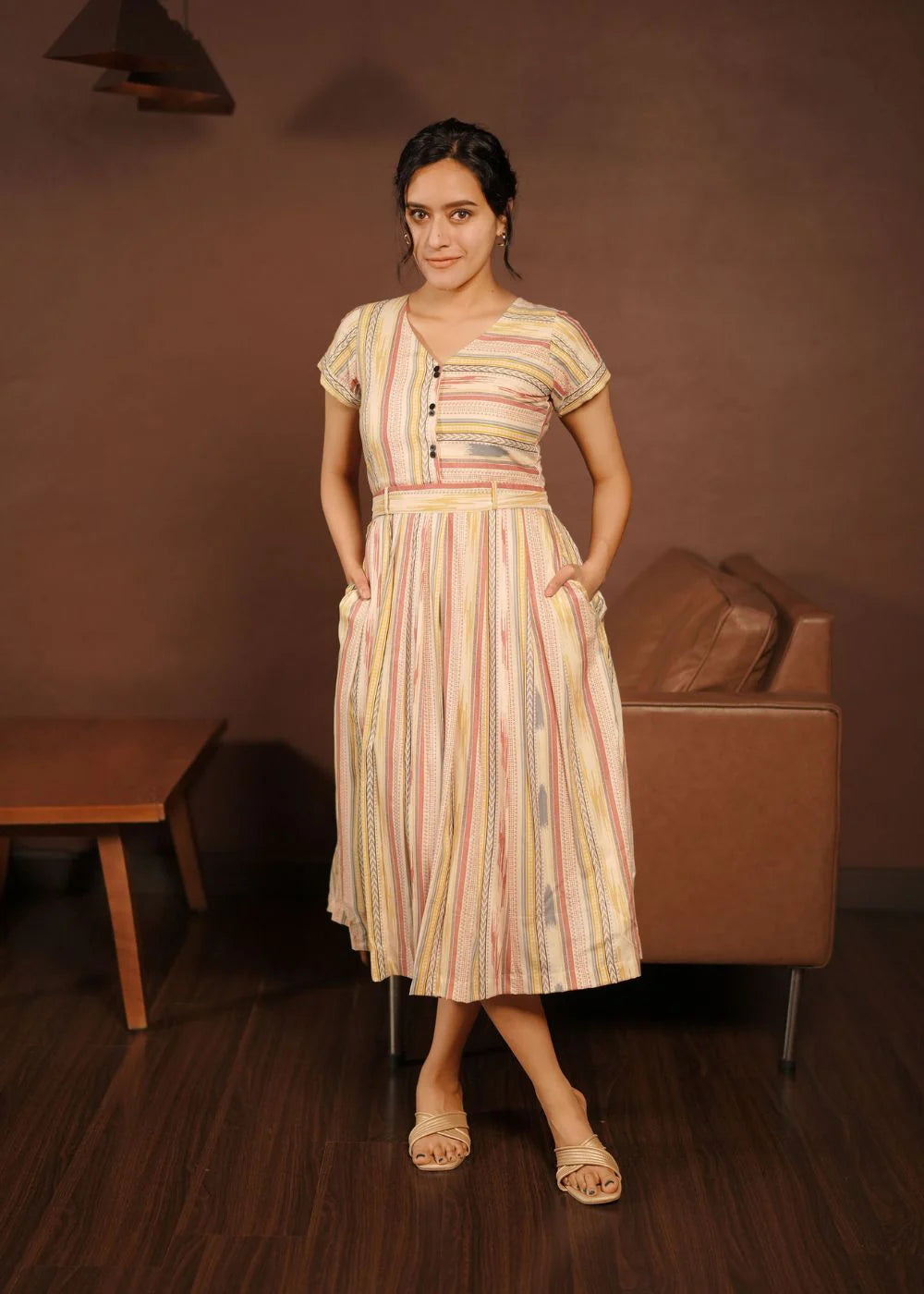 A classy cream &amp; multicolor striped dress featuring a V neck