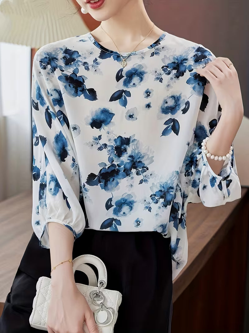 This refined Top showcases a delicate floral print Top