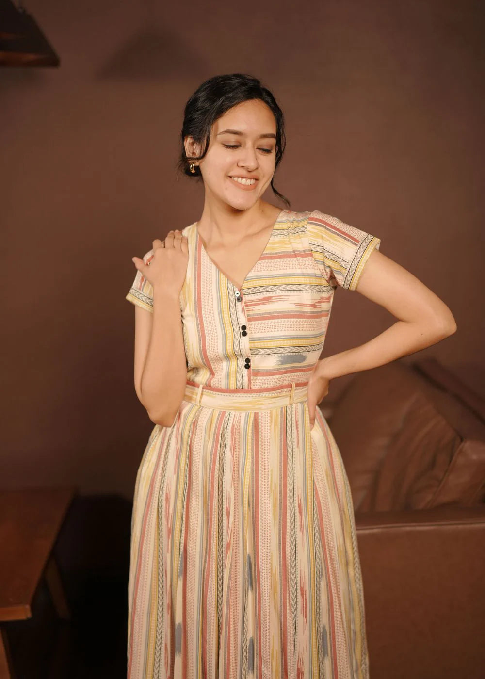 A classy cream &amp; multicolor striped dress featuring a V neck