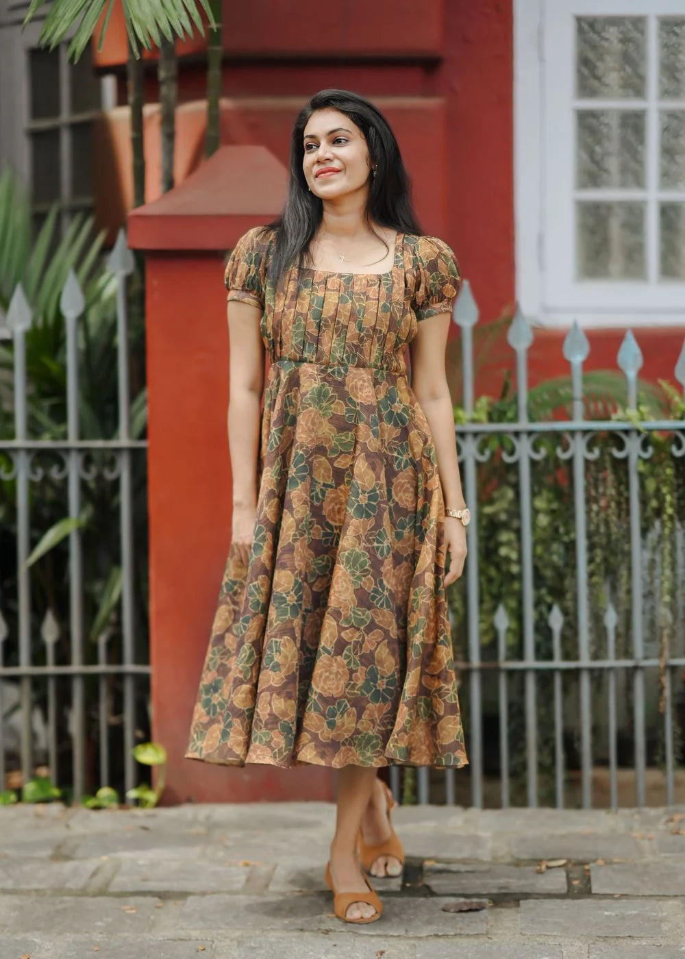 A flowy brown &amp; golden yellow floral print tissue dress