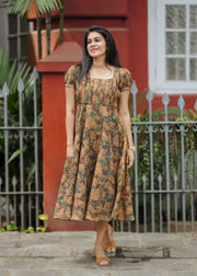 A flowy brown &amp; golden yellow floral print tissue dress