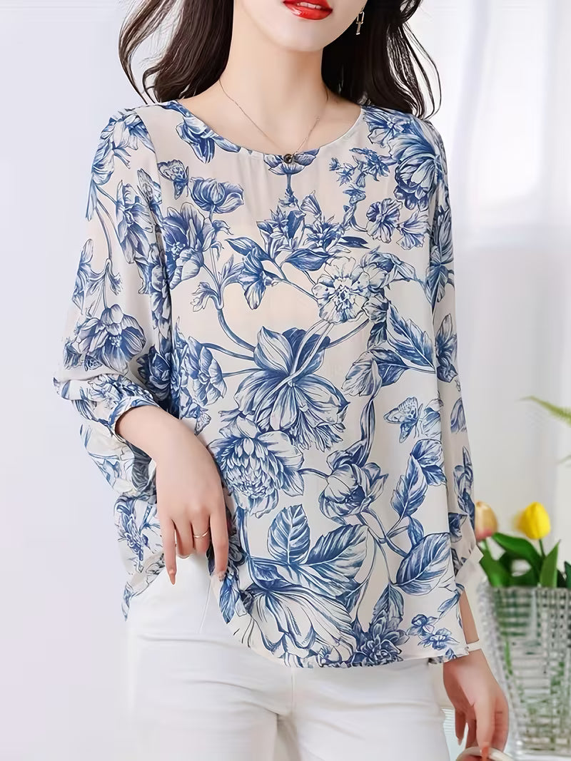 This graceful Top features a soothing palette of blue floral prints