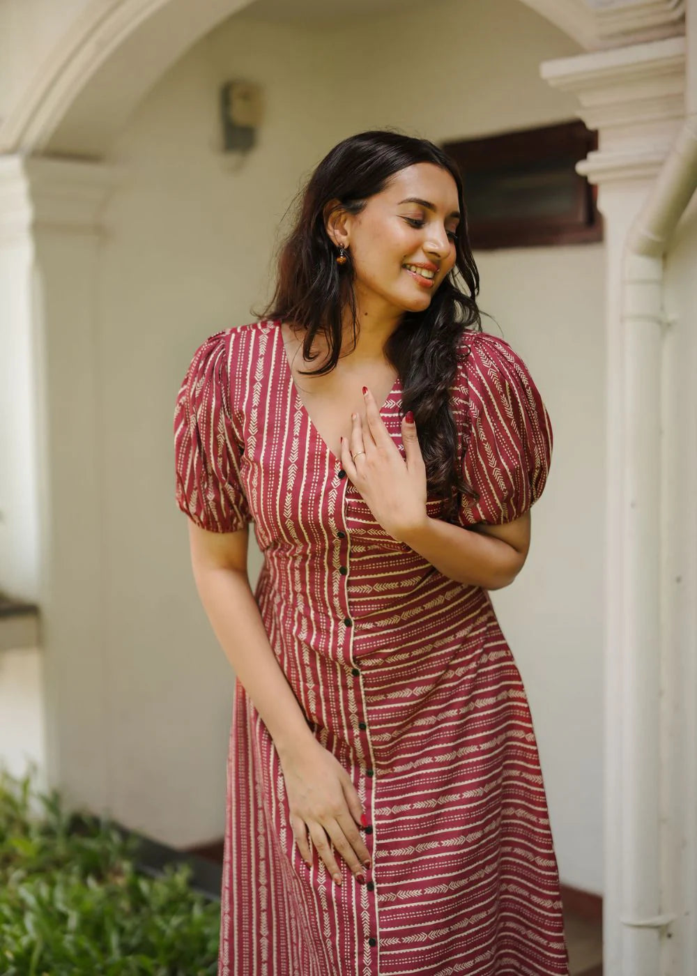 A classy cream &amp; multicolor striped dress featuring a V neck