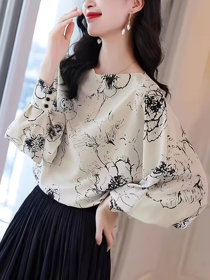 Monochrome Floral Puff-Sleeve Black floral motifs scattered across a white base Top