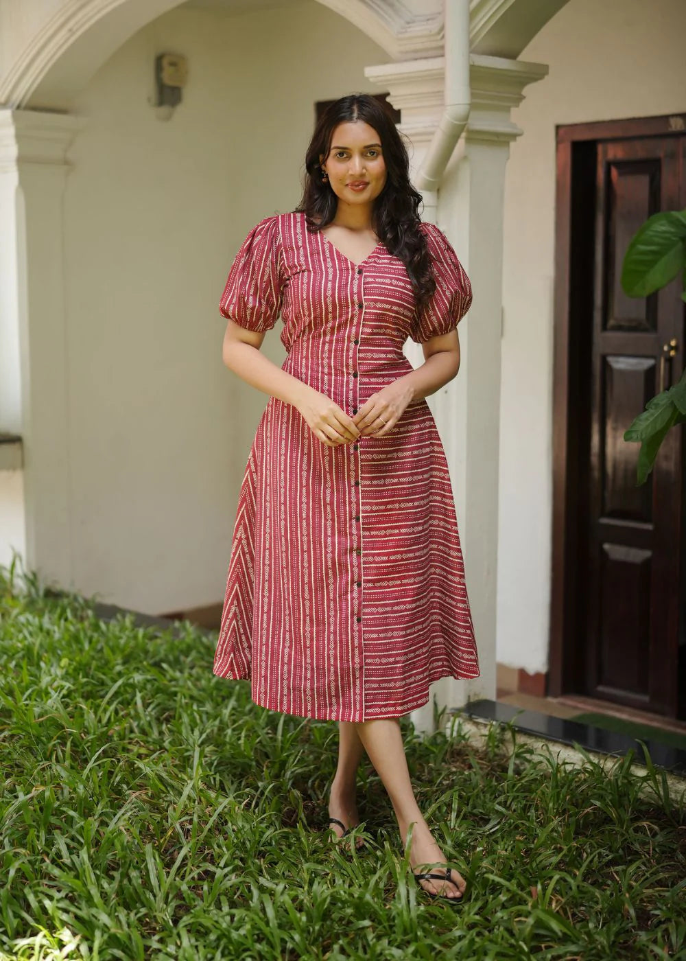 A classy cream &amp; multicolor striped dress featuring a V neck