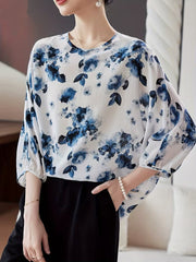 This refined Top showcases a delicate floral print Top