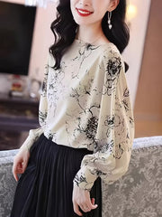 Monochrome Floral Puff-Sleeve Black floral motifs scattered across a white base Top