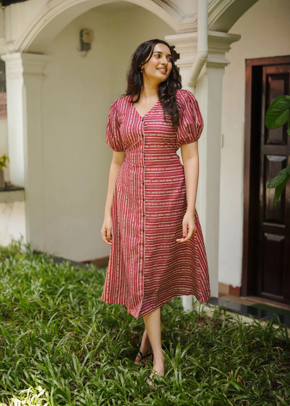 A classy cream &amp; multicolor striped dress featuring a V neck