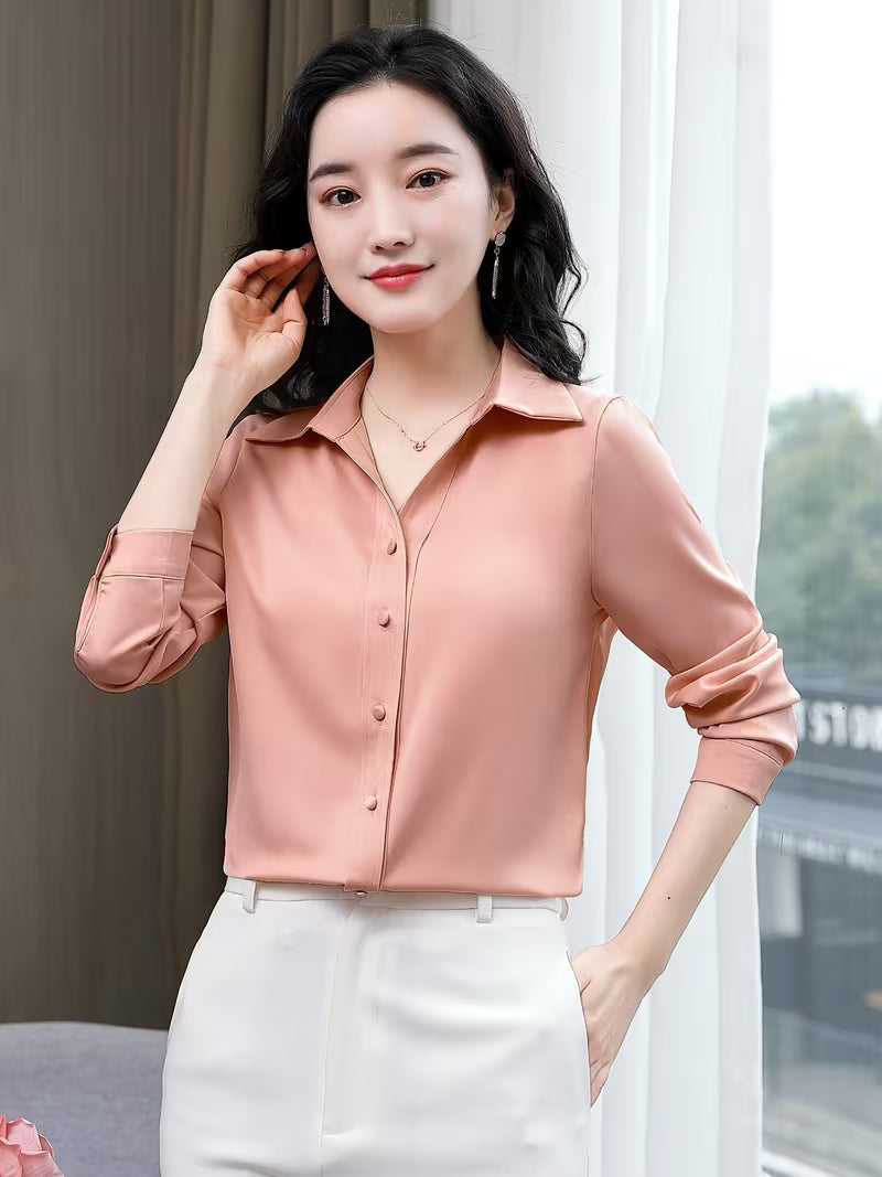 Elegant shirt is crafted from a lustrous silk satin
