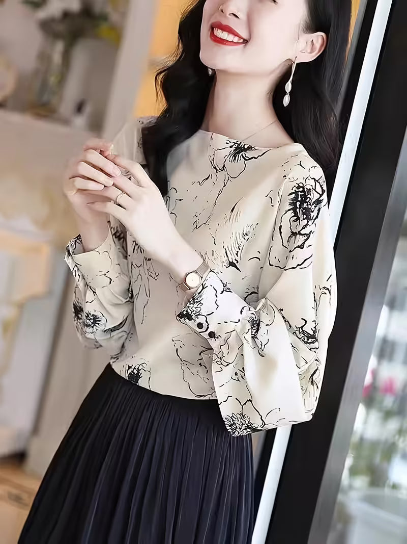 Monochrome Floral Puff-Sleeve Black floral motifs scattered across a white base Top