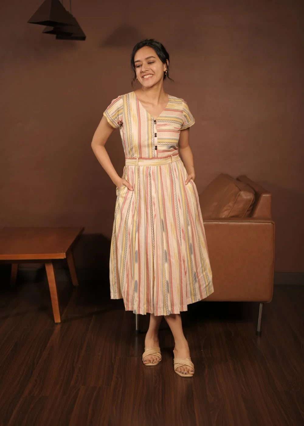 A classy cream &amp; multicolor striped dress featuring a V neck