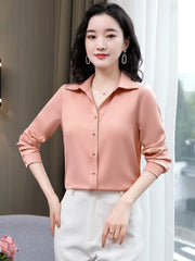 Elegant shirt is crafted from a lustrous silk satin