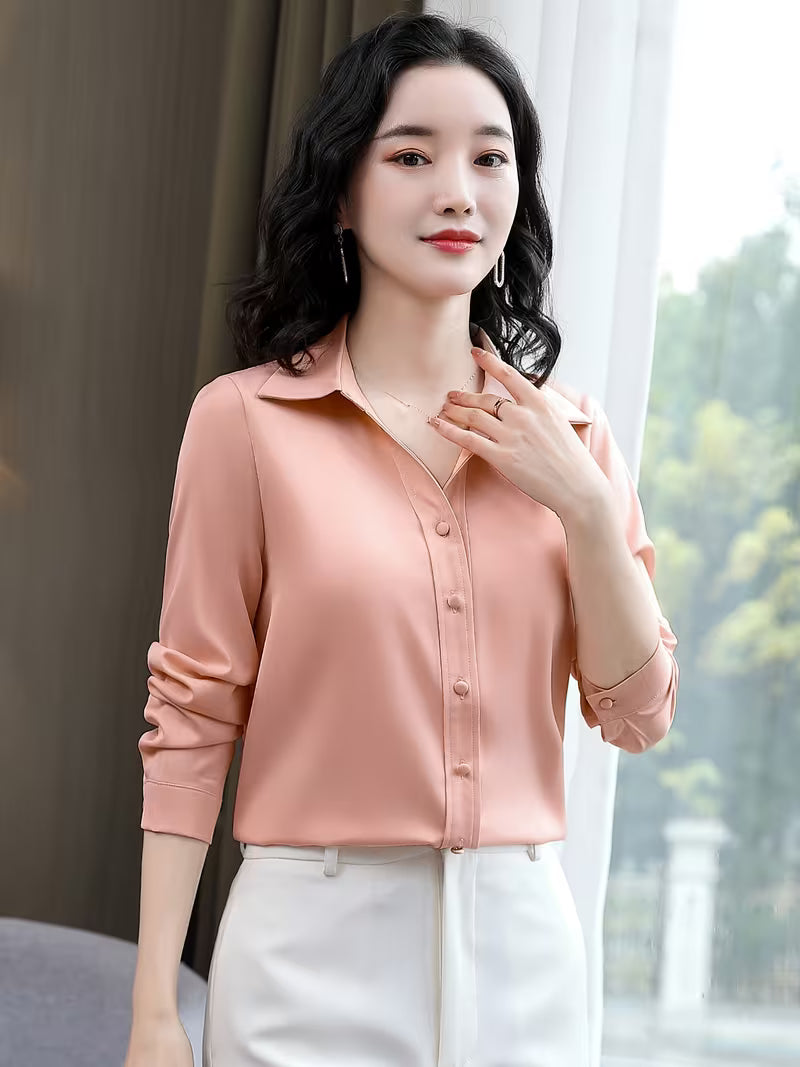 Elegant shirt is crafted from a lustrous silk satin